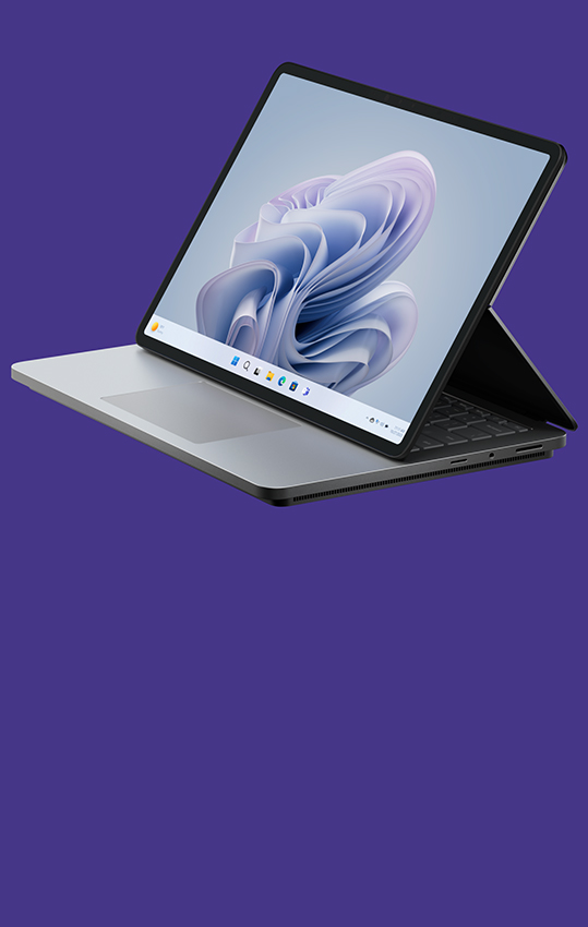 زاوية جانبية لـSurface Laptop Studio 2 تعرض شاشة Windows bloom.